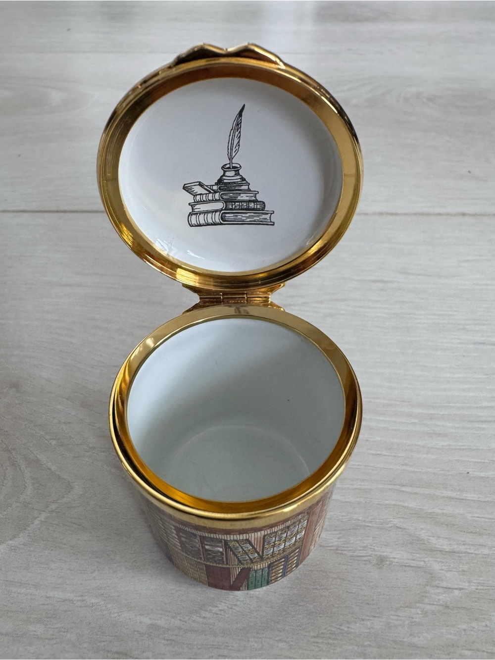 Enamel trinket box with bookshelf design by Halcyon Days